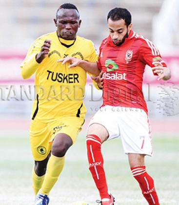 Tuskeru2019s Joshua Oyoo (l) tackles Al Ahlyu2019s Ahmed Sedik in the Champions League first round first. Net photo.