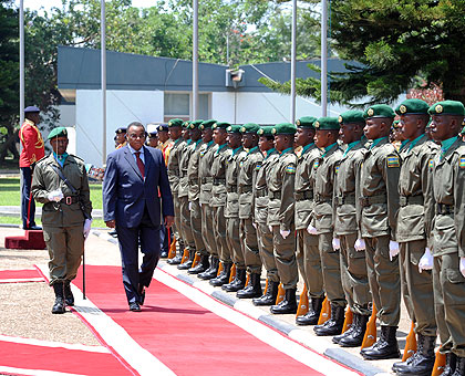 Mwangemi inspects a guard of honour before presenting his credentials to President Kagame yesterday. The New Times/ Village Urugwiro.