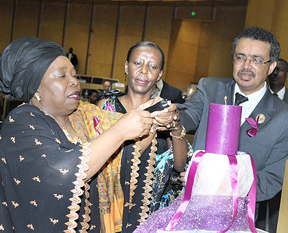 L-R: Dr Zuma, Mushikiwabo and Adhanom light a memorial candle in Addis Ababa. Courtesy