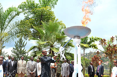 President Kagame lights the  The Flame of Hope at the Kigali Genocide Memorial Centre. (Photos by Village Urugwiro  & T. Kisambira.) 