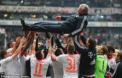 Head coach Jupp Heynckes is thrown into the air in celebration. Net photo.