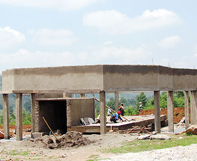 Masons work at a Genocide memorial centre in Kabakobwa. Thousands of fleeing Tutsis from Ngoma commune and the surrounding districts took refuge in a church on the hill, only for the m....