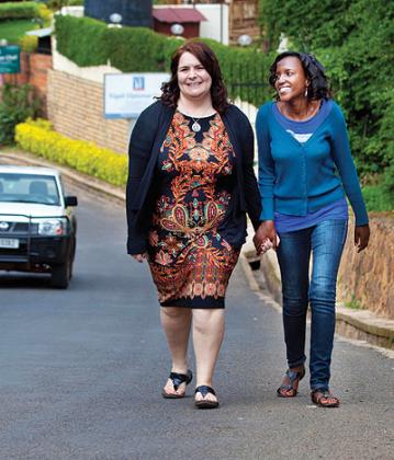 Dr Van Horne (L) and Mukantwali share a light moment as they walk in Kigali last week.