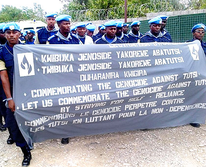 The Rwanda National Police officers serving under the UN Mission for Stabilisation in Haiti mandate march in the capital Port-au-Prince, on Sunday, to pay tribute to the more than a mi....