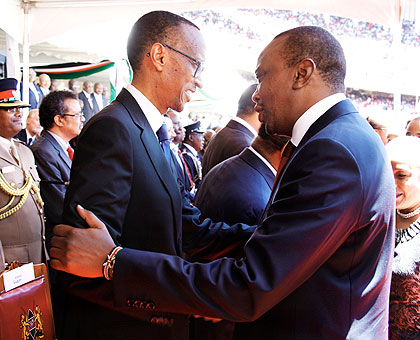 President Paul Kagame (L) congratulates new Kenya President Uhuru Kenyatta after the inauguration yesterday.  Courtesy photo