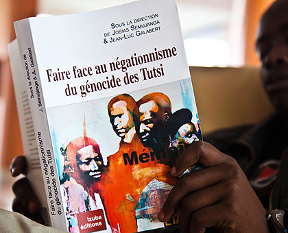 A man reads the newly-published book on Genocide denial yesterday. Rwandans have been urged to document the Genocide in order to fight denial. Saturday Times/ T. Kisambira.