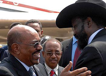 Al- Bashir shares a light moment with Kiir. Net photo.