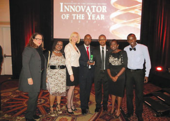 Yves Iradukunda (3rd from right)  and colleagues show off the Creativity Award. Sunday Times/Courtesy