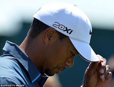 Woods looking downcast in the third round at Augusta. Net photo.