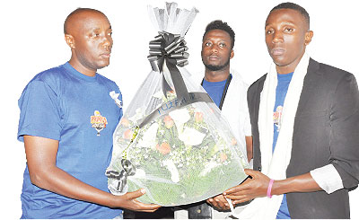 Primus Guma Guma SuperStar contestants lay a wreath at the Rwakibuza memorial site during a ceremony on Friday in Kamonyi.