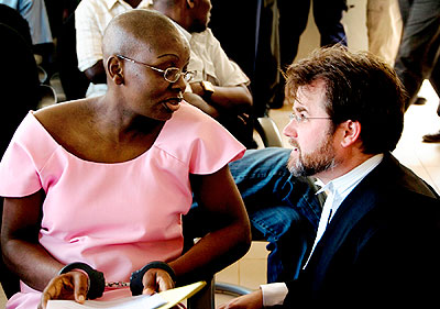 Ingabire (L) consults with her lawyer Edwards during her trial. She is challenging her sentence today. The New Times/ File.
