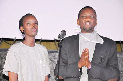 Miss Rwanda Aurore Mutesi and singer  Intore Masamba at the commemoration event. The New Times / File.