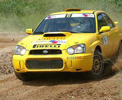 Davite Giancarlo and Slyvia Vindevogel cruising their Subaru Imprezza in past rally. The duo, in their new Mistubishi Evo 10 are already in South Africa. The New Times / File.