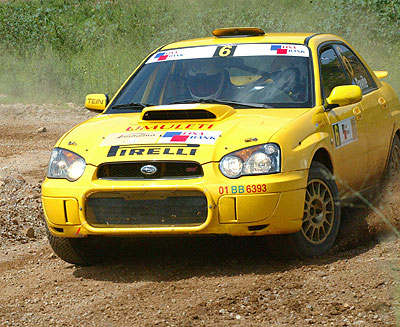 Davite Giancarlo and  Slyvia Vindevogel cruising their Subaru Imprezza in past rally. The duo, in their new Mistubishi Evo 10 are already in South Africa. The New Times / File.