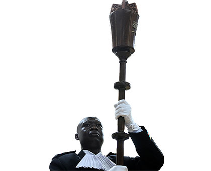 The mace bearer enters the Parliamentary Buildings yesterday. The Times/Village Urugwiro. 