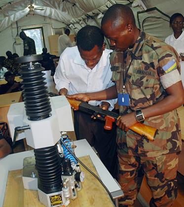 Officials mark firearms in Kigali on Monday.  The New Times/ John Mbanda.