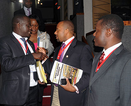 EALA members chat at the end of yesterdayu2019s business. The New Times/John Mbanda.