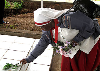 A nun pays her respects to Genocide victims in Munyaga. The New Times/S. Rwemebeho.