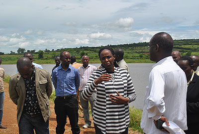 Dr Kalibata (L) talks to officials and rice farmers in Nyagatare recently. The minister told the farmers that with improved farming methods, they can hit Rwf3.5 billion annually.  The New Times/ T. Ishimwe