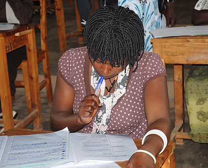 A private candidate sits a previous national examination. The New Times/File.
