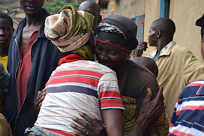 A refugee embraces a relative during their tour of the country. The New Times/ Courtesy.