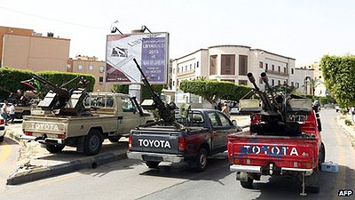 Men in pick-up trucks bristling with anti-aircraft guns have blocked off Libyau2019s foreign ministry, demanding a jobs ban on Gaddafi-era officials..Net photo.