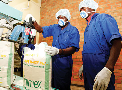 Workers of MINIMEX, a miller, package maize flour. RDB has moved to boost the capacity of small manufacturing and agro-processing firmsu2019 performance through targeted training.The New Times / John Mbanda