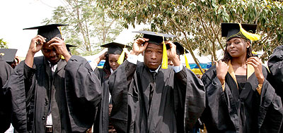 Kigali Institute of Management graduands adjust their mortarboards . Education Times/ Timothy Kisambira