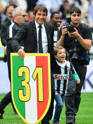 Juventus coach Antonio Conte celebrates after his side wrapped up the Serie A title with a 1-0 home win over Palermo. Net photo.
