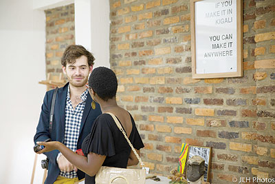 Guillaume Sardin explains to an art fan at the exhibition.  All photos/Juliet Hutchings.