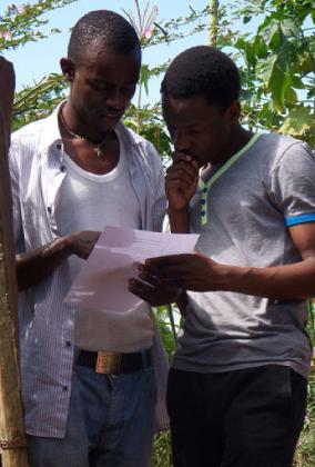Richard Mugwaneza (R) gives directing tips. (Inset) Art department on set.
