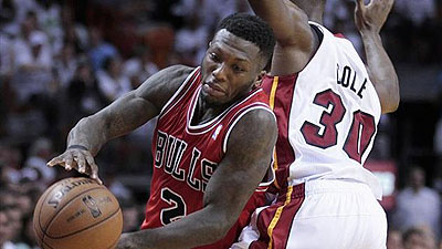 Chicago Bulls point guard Nate Robinson (2) goes around Miami Heat point guard Norris Cole (30) .