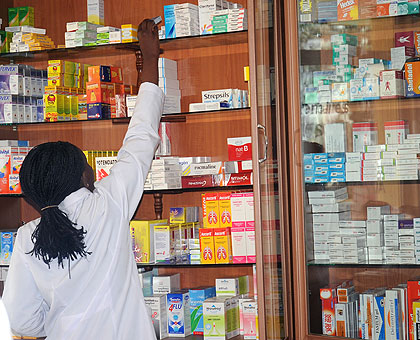 A pharmacist picks drugs to dispense. A new drug regulatory agency will ensure quality drugs delivery in the country. The New Times/ File.