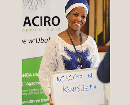 A woman fundraises for Agaciro Development Fund. The Africa Progress Panel says the Fund is capable of ending donor aid. The New Times/  File.