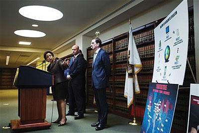 Lynch (pointing), US Attorney for the Eastern District of New York, addresses reporters about the issue in New York on May 9.