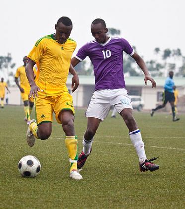AS Kigali's Amini Mwizerwa (left) shields the ball from  Idesbard Nshuti of La Jeunesse in the correspoding fixture at Stade de Kigali.  Saturday Sport / T. Kisambira