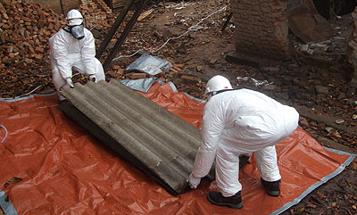 Technicians prepare asbestos roofs for disposal during a past exercise. The New Times/ File. Technicians prepare asbestos roofs for disposal during a past exercise. The New Times/ File.