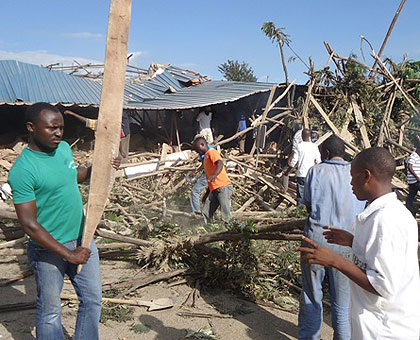 Rescuers go through the rubble to save survivors after a four-storey building collapsed in Nyagatare yesterday. The New Times/ Dan Ngabonziza. 