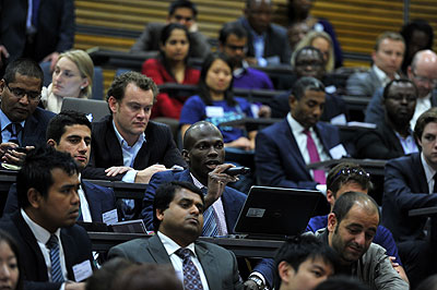 A participant poses a question to President Kagame during the Fifth Annual Oxford Africa Business Conference at Said Business School, London. The New Times/Village Urugwiro.