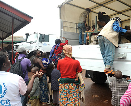 Returnees from Uganda board a truck at Gatuna border post recently. The Cessation Clause will be invoked on June 31. The New Times/ File.