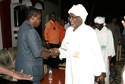CECAFA Secretary General Nicholas Musonye [left] being welcomed by North Darfur Governor Osman Mohammed Kebir at his residence. The New Times / Courtesy.