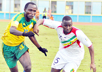 Amavubi Stars full back Kalisa Mao (left) battles with a Mali player during the previous 2014 World Cup qualifier in Kigali. Rwanda lost 2-1. The New Times / P. Muzogeye.
