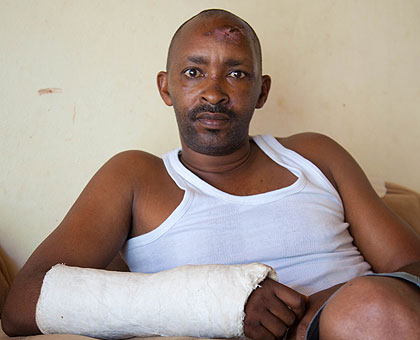 Barigye at his Kabeza home, where he is still nursing injuries suffered after his building collapsed, trapping him and other employees. The New Times/Timothy Kisambira. 