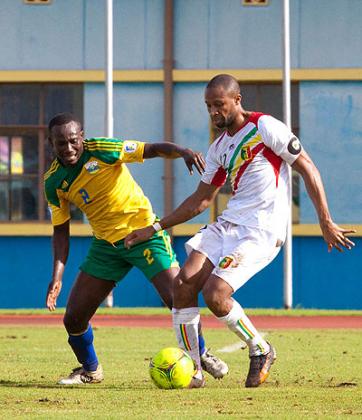 Defensive midfielder Fabrice Twagizimana battles for the ball with Mali captain Seydou Keita in March's World cup qualifier.He has been called in Nshimiyimana's first Amavubi call-up. The New Times / T. Kisambira.