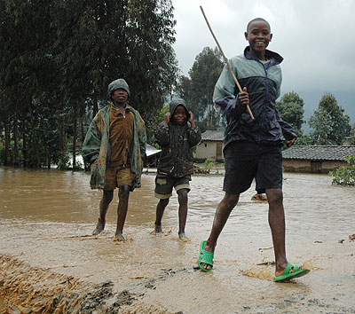 Children play after heavy rains. Over 80,000 households have been earmarked for evacuation countrywide according to officials.  New Times/File. 