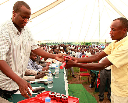 Brig. Gen. John Bagabo handing over equipment to ex combatants at a previous event. Sunday Times/File.