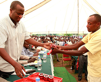 Brig. Gen.  John Bagabo handing over equipment to ex combatants at a previous event. Sunday Times/File.