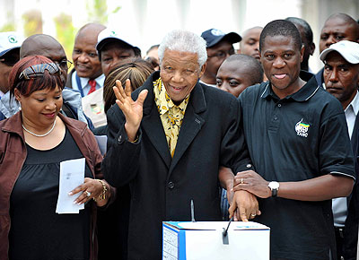 Former president of South Africa Nelson Mandela (C) in a file photo casting his vote at a polling station during the election in Johannesburg, South Africa.  Mandela is in u201cis getting betteru201d after being taken to a hospital to be treated for a lung infection. Xinhua/photo.