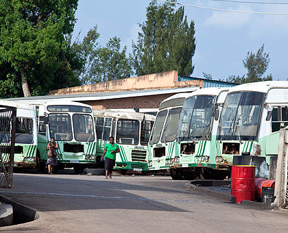 Some of the Onatracom buses in a state of disrepair in the agencyu2019s garage. The New Times/ Timothy Kisambira.