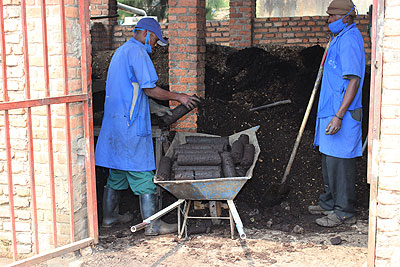 Workers make Briquettes out of waste. Guyana intends to learn from Rwanda about waste managenent. Courtesy photo.